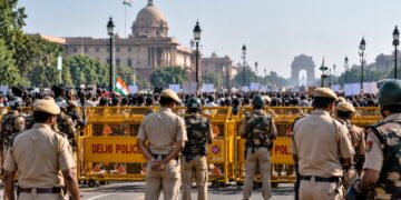 Delhi protests with police barricades and security personnel near India Gate